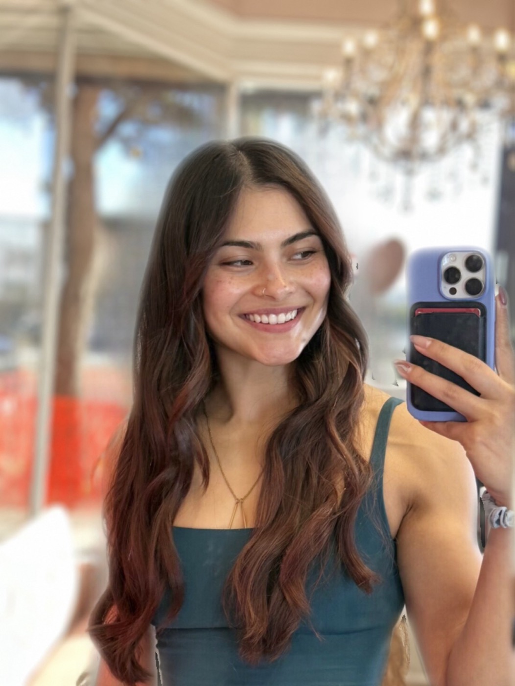 Client with long, wavy dimensional brunette hair