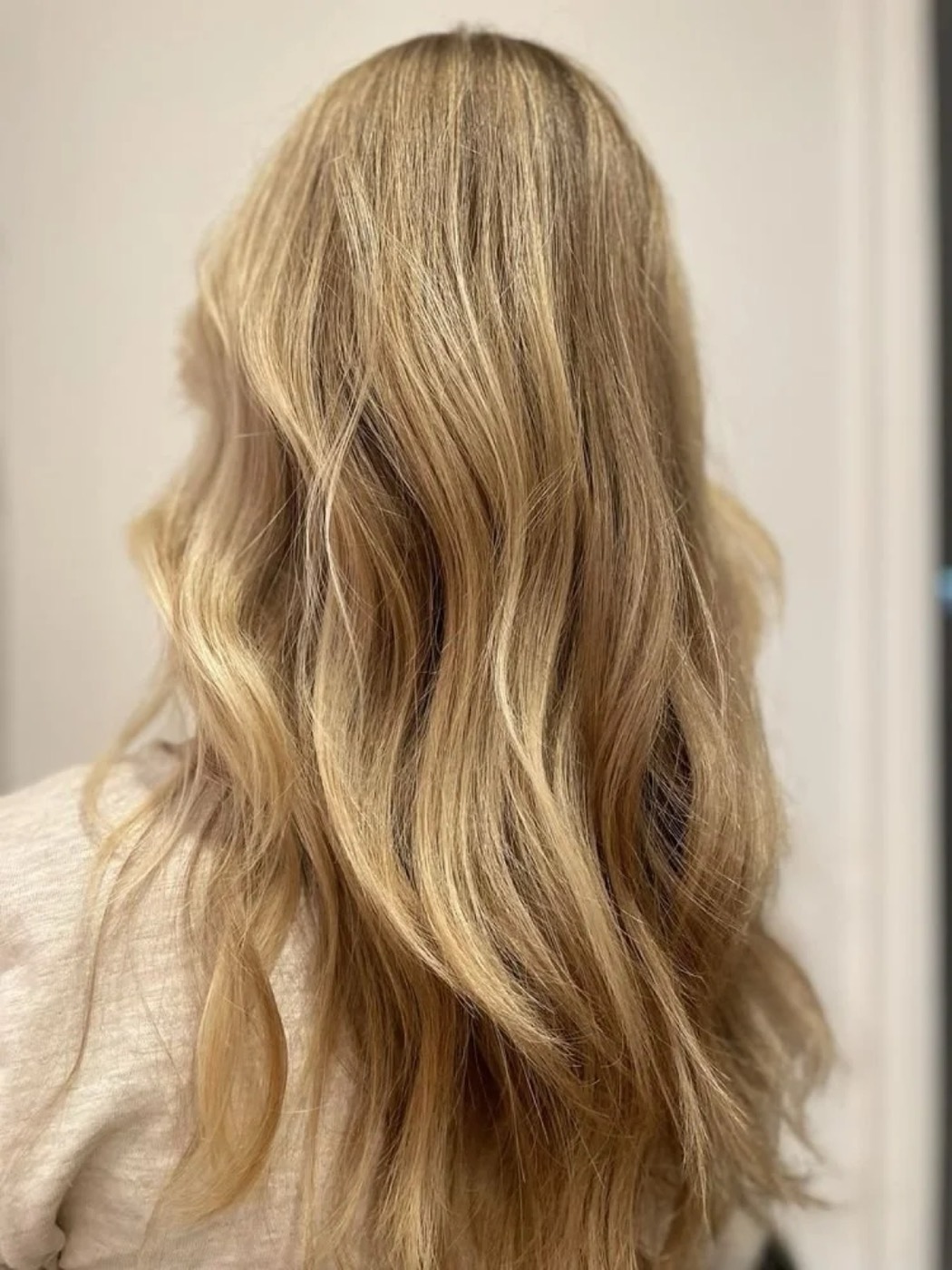 Back view of long, wavy blonde hair.