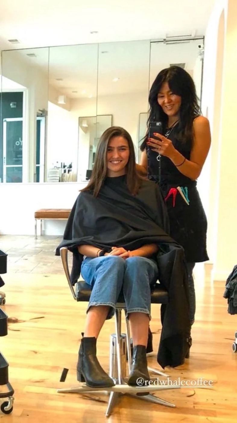 Helen styling a client in the salon