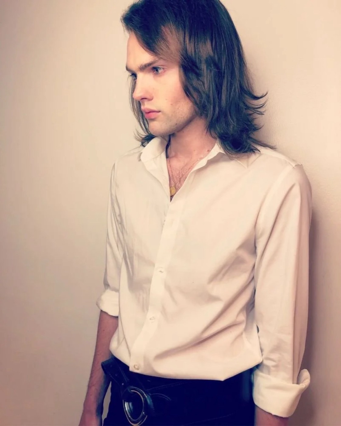 Man with long, layered dark hair
